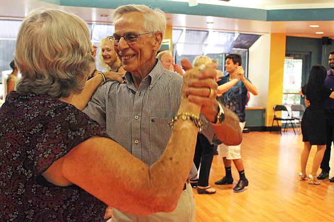 Photo by: Sarah Wilson - Caregivers and volunteers twirl their partners through choreographed routines.
