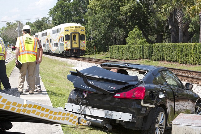 Photo by: Allison Olcsvay - A SunRail train collided with a car in Maitland on Monday, May 19, the first day of paid commuter rail service.