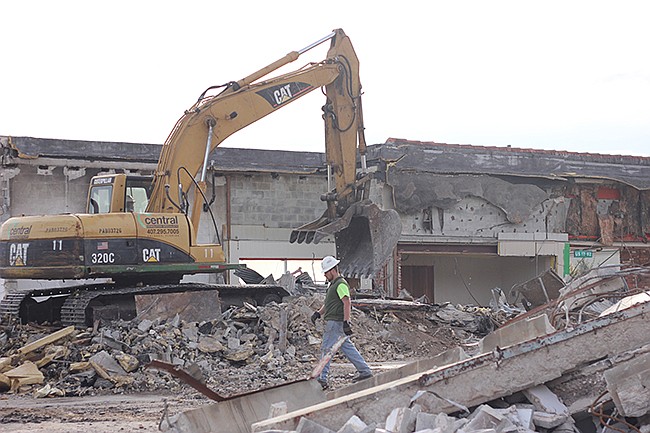 Photo by: Sarah Wilson - Demolition crews level a Maitland Winn-Dixie that had been empty for a decade.