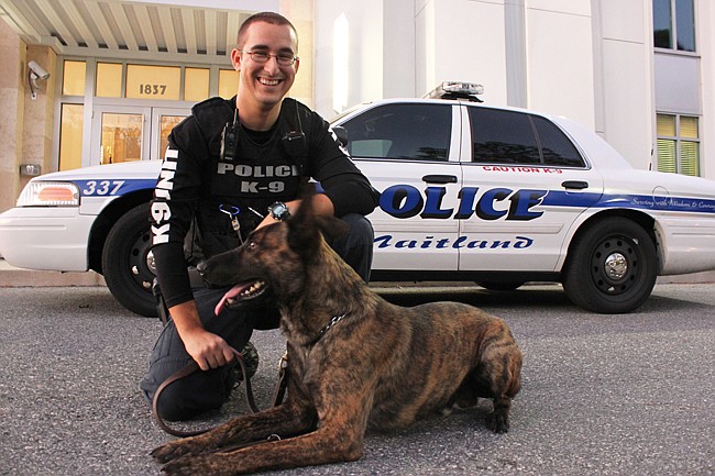 Photo by: Sarah Wilson - Maitland Police officer Taylor Stitt and K-9 officer Bosco outside the city's police complex.