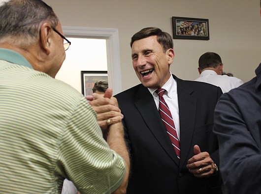 Photo by: Sarah Wilson - U.S. Rep. John Mica celebrates after learning of his primary victory at the Seminole County Republican Party Headquarters in Casselberry.