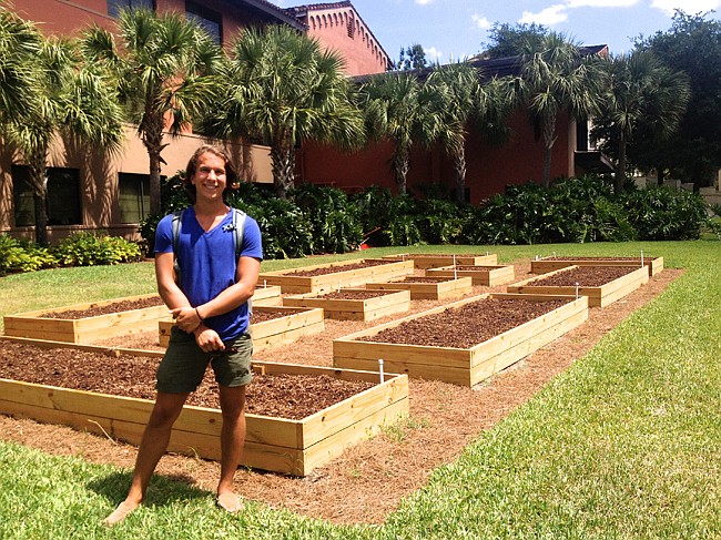 Photo by: Anne Lottman - Andrew Lesmes stands where an urban garden will grow on Rollins College's campus thanks to a $4,000 grant to fund it.