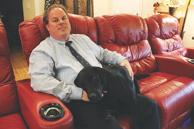 Photo by: Sarah Wilson - Richard Darrington and his guide dog Malcolm have become inseparable since being paired through Southeastern Guide Dogs last April. The pair will participate in a Walkathon benefit on March 12.