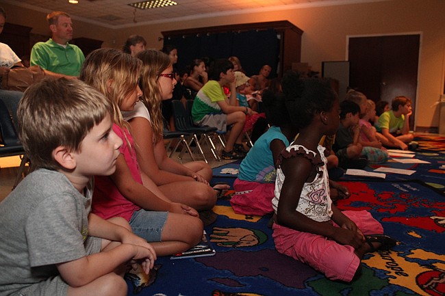 Photo by: Rebecca Males - Children watched a live show of "Return to Wonderland" at the Maitland Public Library.