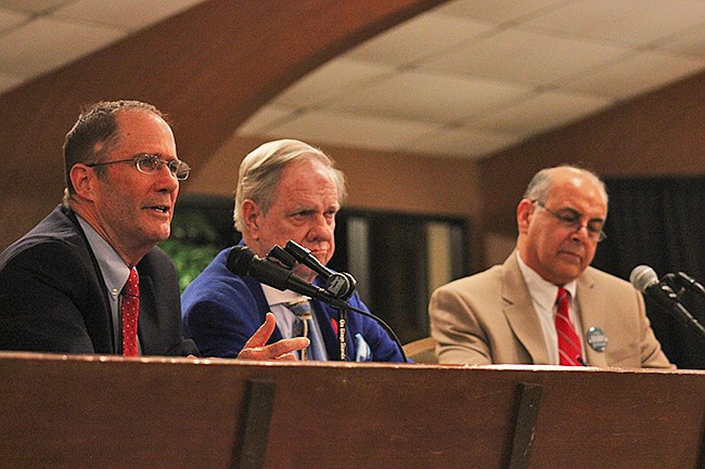 Photo by: Sarah Wilson - Maitland candidates Mike Thomas, left, and Mike Dabby, right, debated at a forum moderated by Rev. John Butler Book, middle.