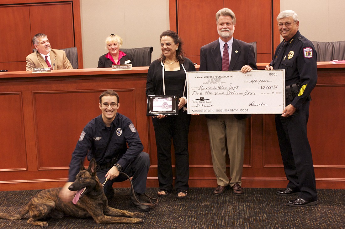 Photo by: Sarah Wilson - Chief Doug Ball presented a $5,000 check to the Maitland City Council that was received from an anonymous donor to be used for the Police Department's K-9 Unit.