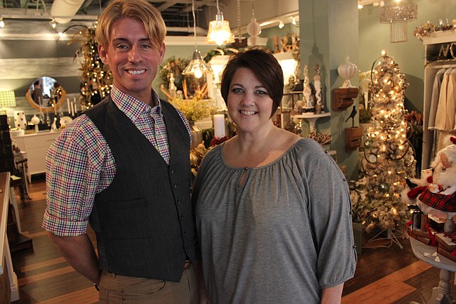 Photo by: Sarah Wilson - Christmas cheer is everywhere at Hannibal Square's newset shop. Manager Chris Scott and sales associate Kim Whittaker help shoppers find the best gifts for all occasions at Lafayette & Rushford.
