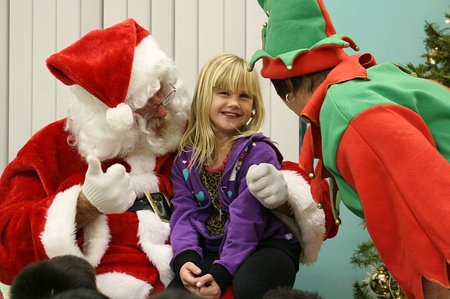 Photo by: Allison Olcsvay - Keara O'Steen signed her Christmas wish list to Santa at a special event for deaf children at the Center for Independent Living.