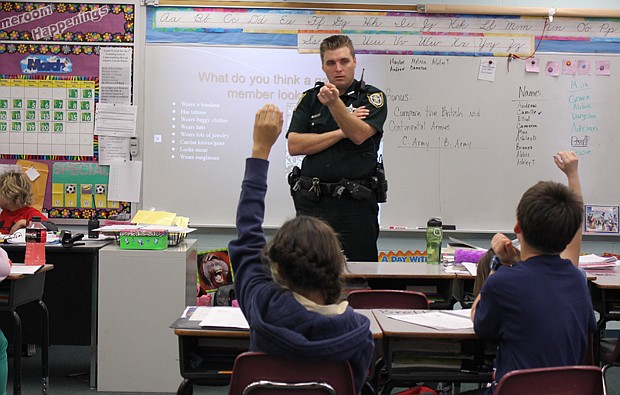 Photo by: Sarah Wilson - Seminole County Sheriff's Deputy Adam Brewster teaches a class as part of a new program that's being spread to all of the county's elementary schools.