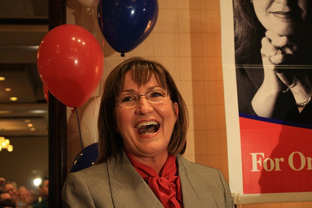 Photo by: By Michael Clinton - Teresa Jacobs reacts to her win in the Orange County mayor race on Tuesday night at the Sonesta Hotel.
