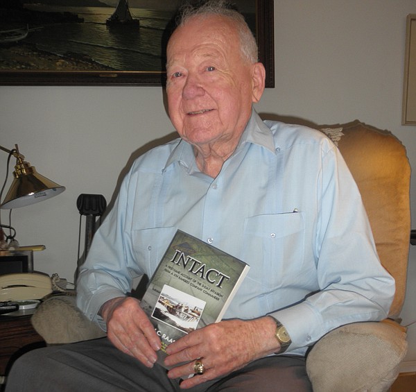 Photo by: Brittni Larson - John Raaen recalls in vivid detail his journey across the beach during the Normandy invasion during WWII in his book "Intact."