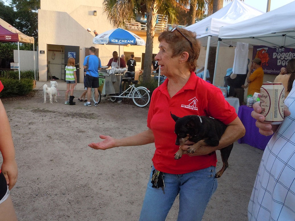 Photo by: Clyde Moore - Judy Sarullo is rarely seen without a tiny dog or cat in hand. The founder of Pet Rescue by Judy has been called a living saint by some who know her.