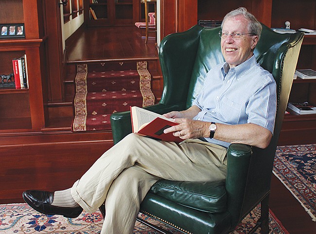 Photo by: Sarah Wilson - Harvard University professor Jack Schott relaxes in his in-home library, which he built as an old-school refuge that adds a touch of class.