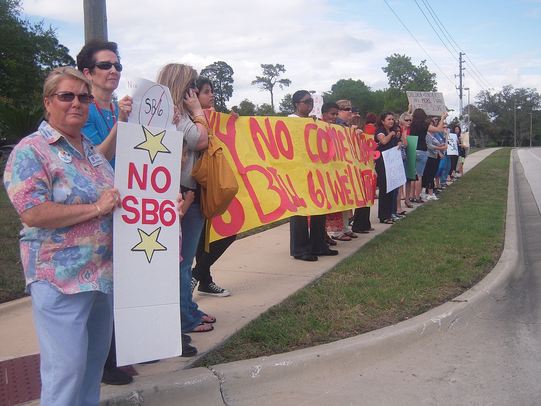 Photo by: Robyn Sidersky - Teachers, students and parents rally at the Seminole County Education Complex on April 13 in protest of Senate Bill 6, which was vetoed on Thursday by Gov. Charlie Crist.