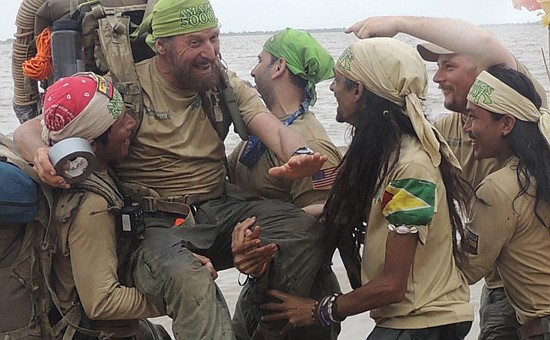Photo: COURTESY OF MICKEY GROSMAN - Mickey Grosman celebrates with his adventure team at the Atlantic seashore in Georgetown, Guyana. The men had endured severe disease, leeches and a pirate attack to make their way through the jungle. Grosman filmed ...