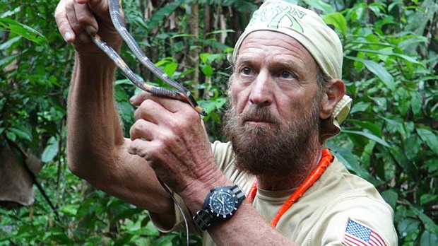 Photo: COURTESY OF MICKEY GROSMAN - Cancer survivor Mickey Grosman holds a snake in the Amazon Rainforest, during a 5,000 mile South America trek.