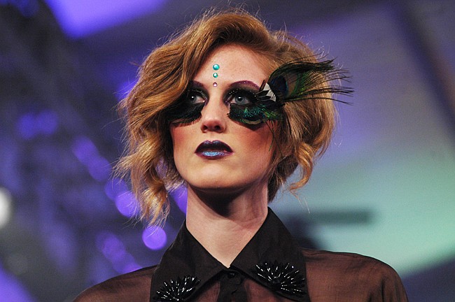 Photo by: Isaac Babcock - A model displays iLashWorks' dramatic eyelash designs on the runway at Harriett's Park Avenue Fashion Week.