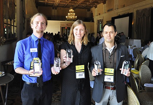 Turnstile Media Group Community Media Division editors Tim Freed, left, Sarah Wilson and Isaac Babcock hold five first place awards that they won for the Winter Park-Maitland Observer and Seminole Voice at the Florida Press Association's Better Weekly...