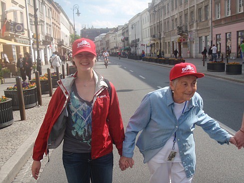 Winter Park student Laurel Cohen walks with a holocaust survivor through the old city of Warsaw, Poland during her trip to learn about the holocaust during WWII.