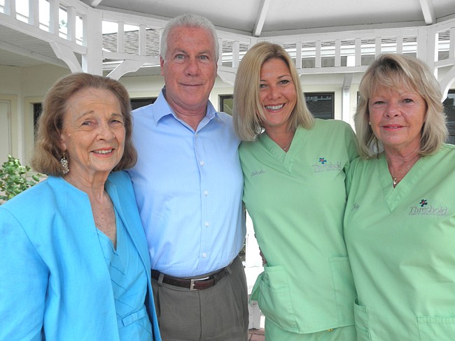 Photo by: Sarah Wilson - Teena Willard with her son-in-law Jim Dennis, granddaughter Tabatha Crosby and daughter Judy Dennis at the Threshold Center for Autism in Winter Park. Three generations of Willard's family still work at Threshold.