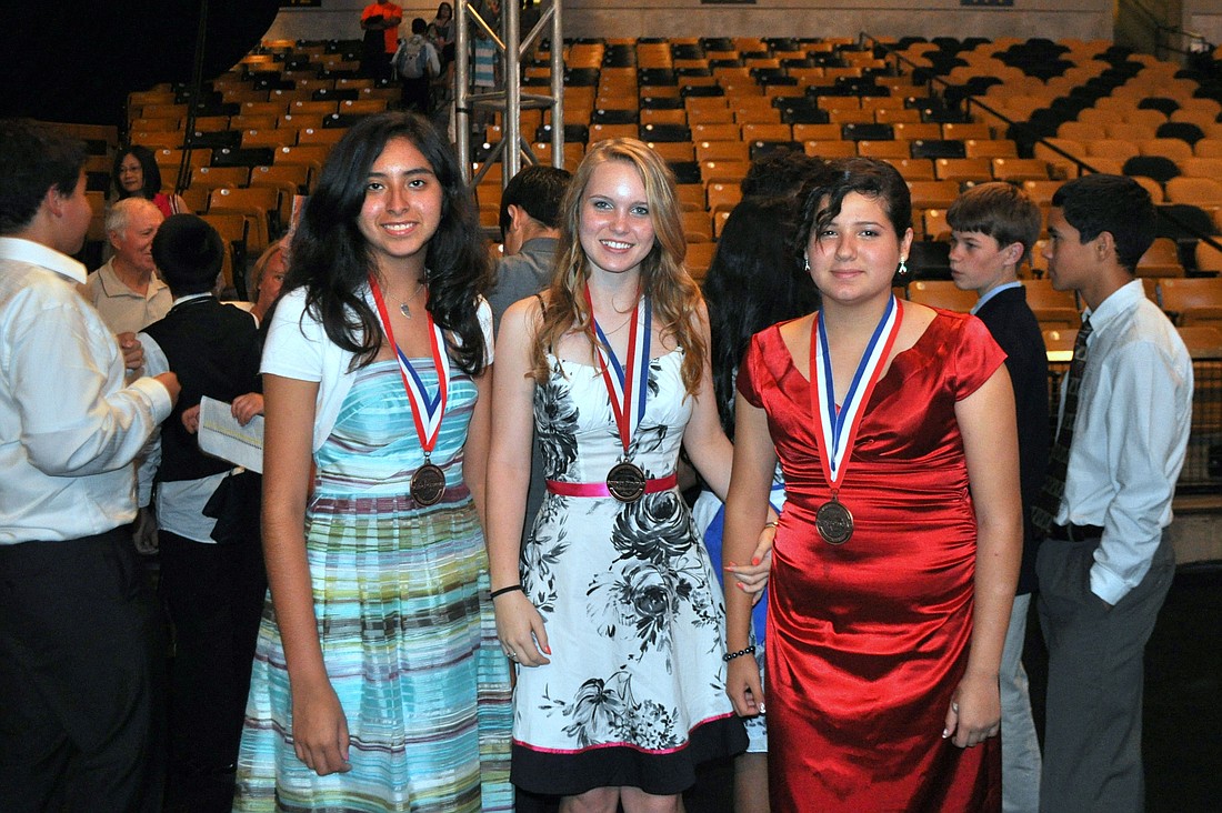 Elizabeth Martin of Apopka, Daniella Gutierrez of Dr. Phillips and Raquel Guerrero of Maitland - all eighth-graders - received sixth place in the "Experimental Design" category at the Science Olympiad National Tournament.