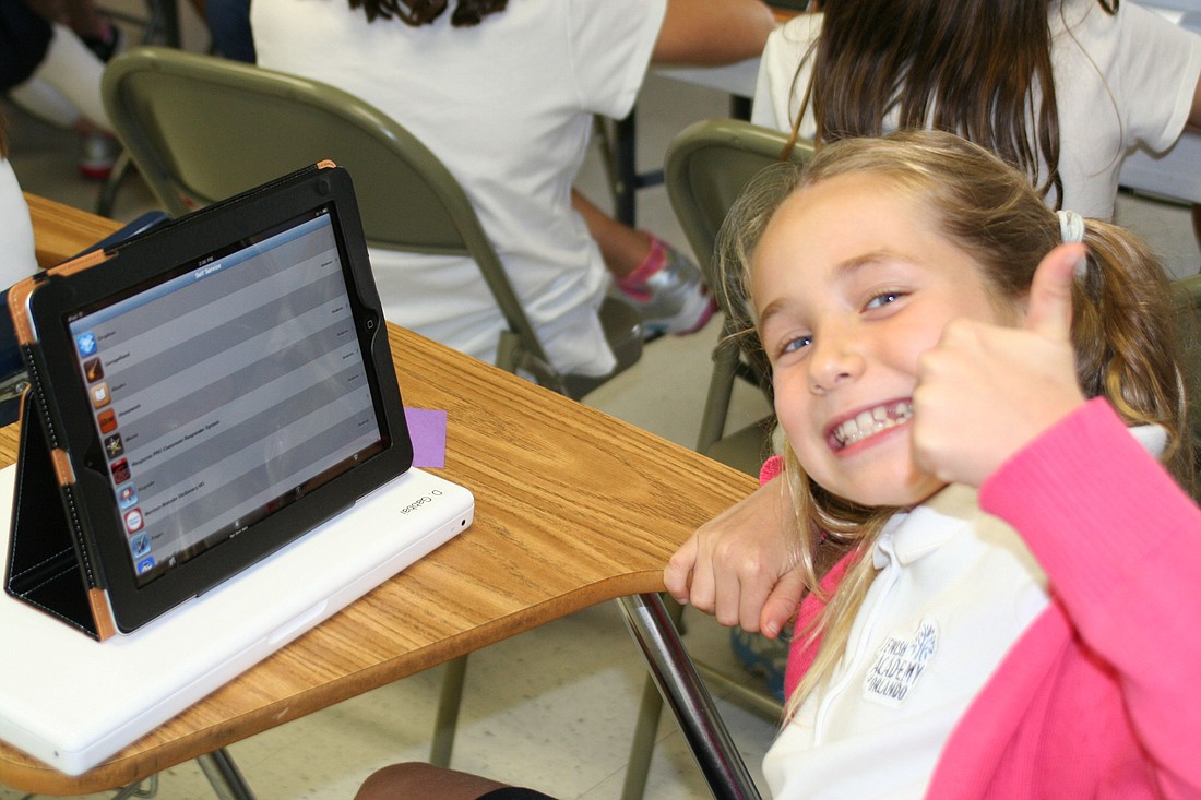 Fourth-grader Danielle Gabbai gives the thumbs-up for the technology she gets to use at Jewish Academy of Orlando.