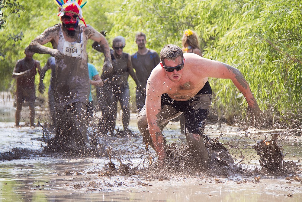 Sam Abbitt races through the mud.