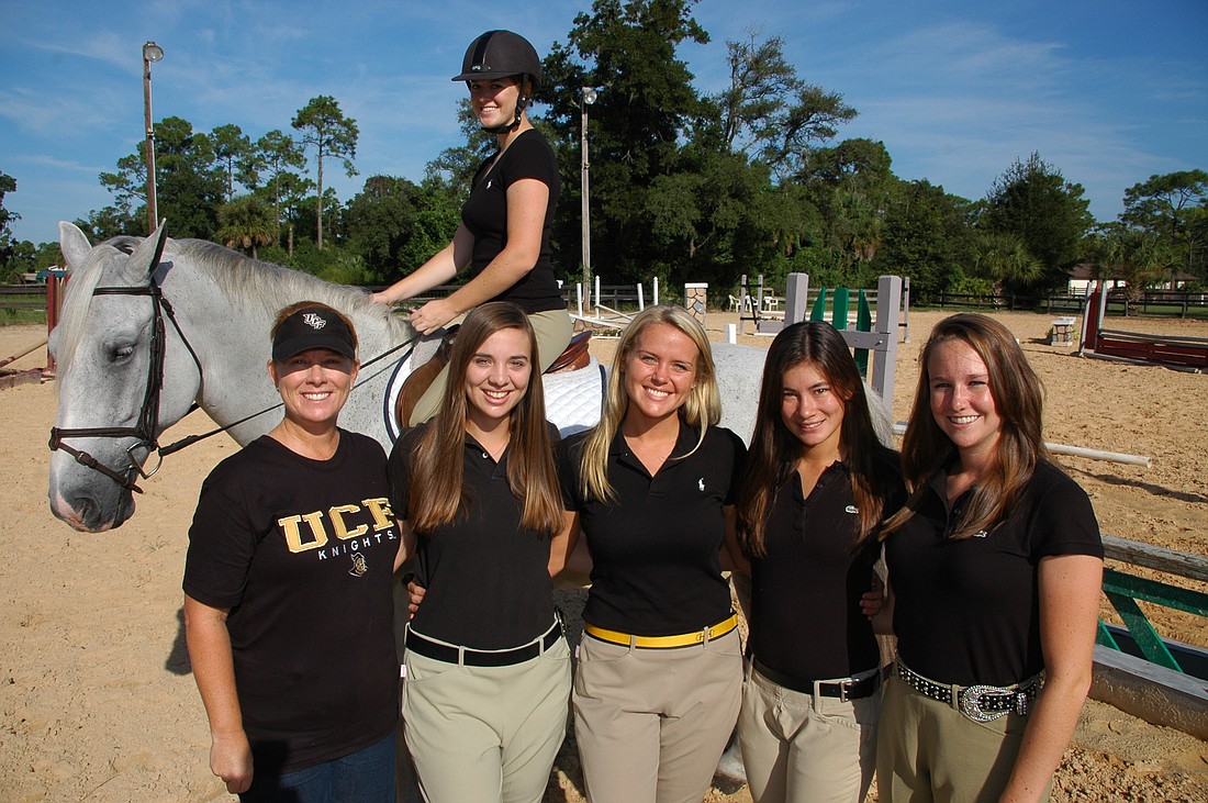 Photo by: Isaac Babcock - UCF's equestrian club competed at the national championships before finally being recognized as a sports club at the university. Now they're hoping to build on their rapid success under coach Lesli Isaacson, left.