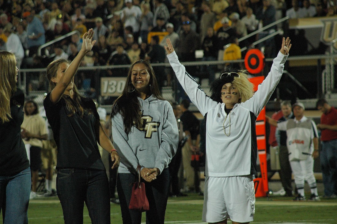Photo by: Isaac Babcock - Players on UCF's women's soccer team say hello to fans at the football team's game against UAB on Oct. 6. The soccer team is No. 19 in the nation.