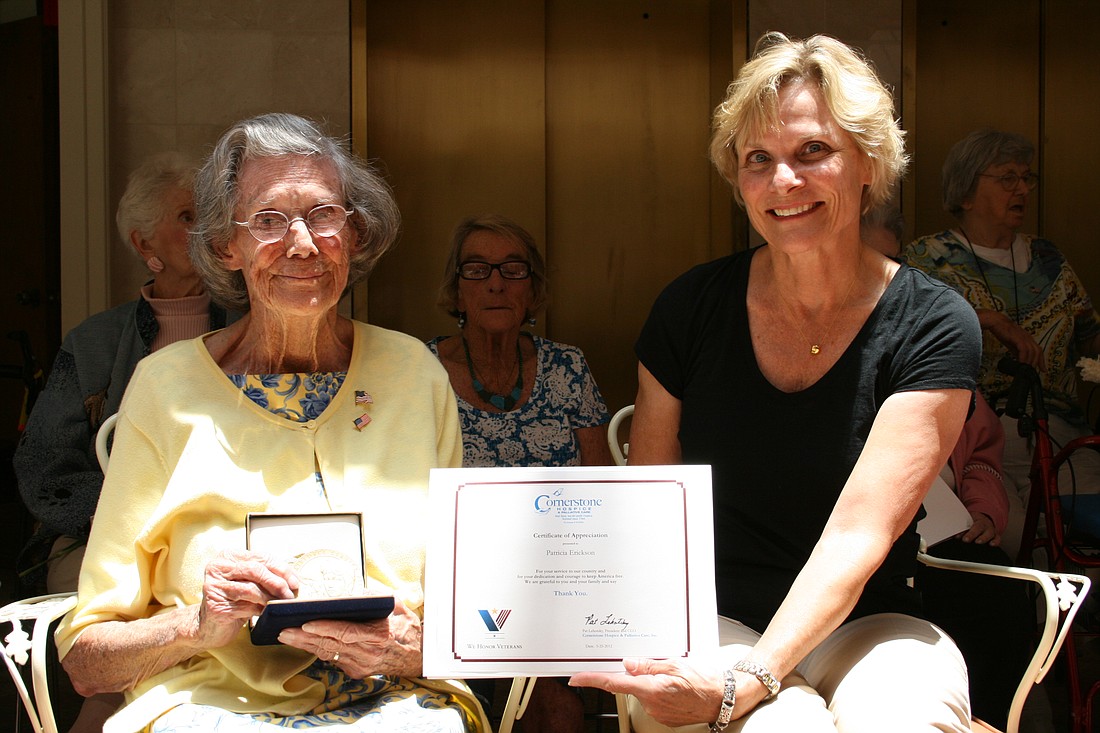 Photo by: The Westchester, Winter Park - Veteran U.S. Air Corps WASP pilot Pat Erickson (left), and daughter Ingrid Campbell Erickson proudly display the Cornerstone Salutes! certificate of appreciation awarded the 92 year-young female pilot during Me...