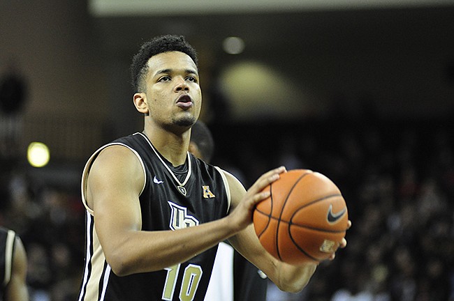 Photo by: Isaac Babcock - UCF's Adonys Henriquez helped the Knights edge the UMass Minutemen, grabbing eight rebounds and forcing three turnovers, plus shooting 11 points on Tuesday.