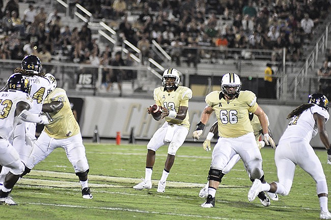 Photo by: Isaac Babcock - University of Central Florida quarterback Justin Holman may return to the field for the Knights' showdown against UConn Saturday. He's been out since breaking his finger against Stanford Sept. 12.