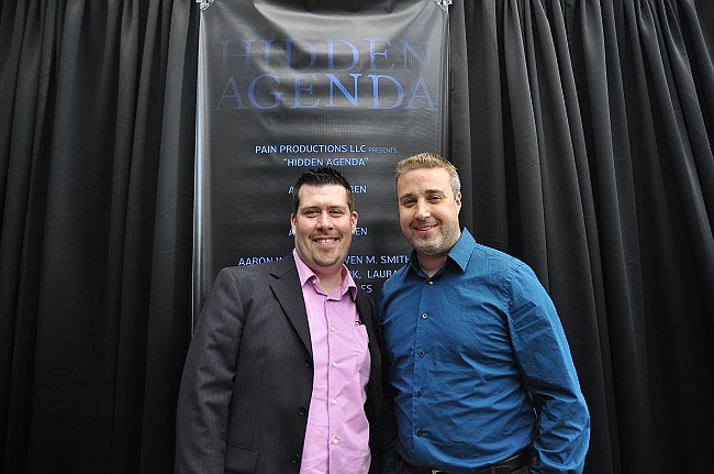 Photo by: Isaac Babcock - Writer-director Aaron Warren, left, and lead actor and executive producer Hans Hernke stand on the red carpet at the premier of 'Hidden Agenda,' which filmed in Winter Park and other local cities.