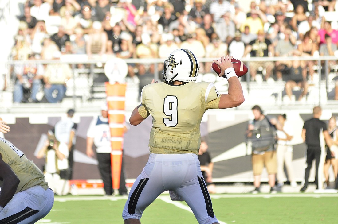 Photo by: Isaac Babcock - Bo Schneider, UCF's go-to starting quarterback in the absence of Justin Holman, broke out of a weak start to throw for 189 yards, going 20-for-35 against South Carolina.