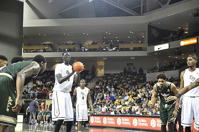 Photo by: Isaac Babcock - The Knights' international freshman phenom Tacko Fall helped lead the team in points on a recent offensive tear. The Knights will need to exceed expectations to make it far in the AAC Tournament.