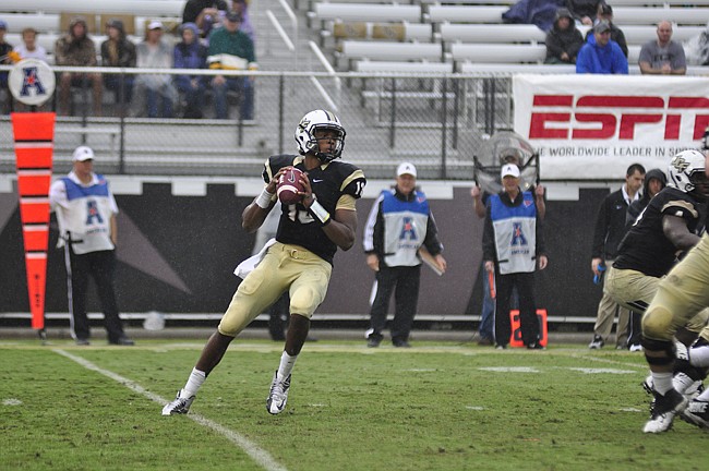 Photo by: Isaac Babcock - ï»¿UCF quarterback Justin Holman has led his team to an 8-3 record so far. The Knights need one more win for their second straight American Athletic Conference championship, and it'll have to come against an East Carolina tea...
