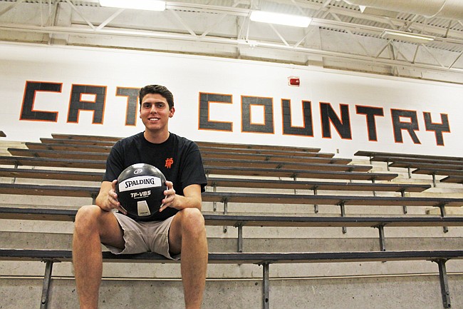 Photo by: Adam Rhodes - Baron Hahn outworked his early handicaps to become one of the most sought-after men's high school volleyball players in the country. He will take his talents to Loyola University this fall.