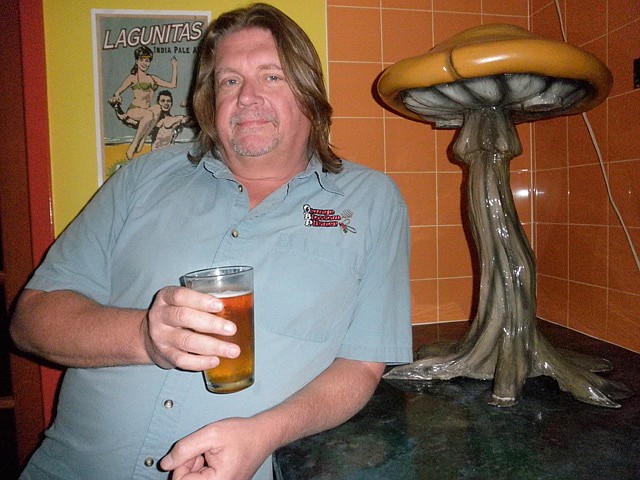 Photo by: Brittni Larson - Tom Moench sips the craft beer he created, Orange Blossom Pilsner, at Mellow Mushroom in Winter Park on Tuesday. It's the most popular beer sold at the pizza restaurant.