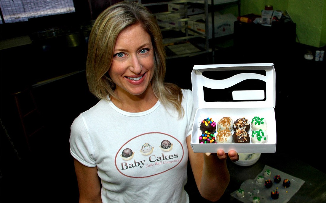 Photo by: Isaac Babcock - Baby Cakes owner Becca Sanders shows off her sweet product.