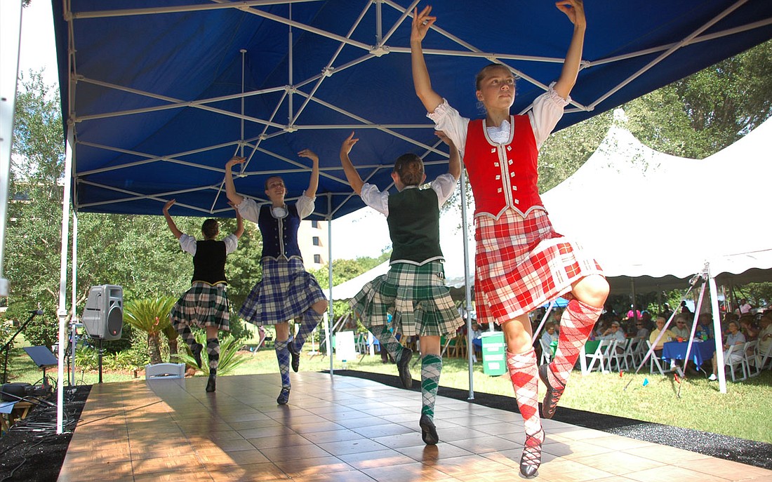 Photo by: Isaac Babcock - Winter Park Towers hosted a Celtic-themed groundbreaking ceremony on June 24 to celebrate its new apartment building, Loch Berry, which boasts 54 state-of-the-art two-bedroom apartments on Lake Berry. A long-awaited parking g...