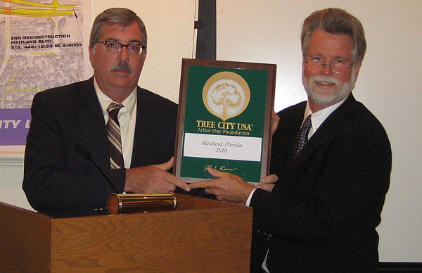 Photo courtesy of city of Maitland - City Arborist Brian Dierks with Mayor Howard Schieferdecker.