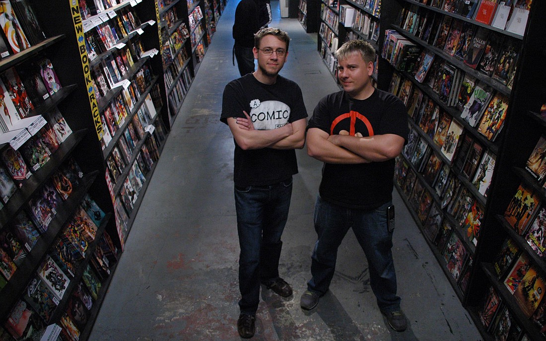 Photo by: Isaac Babcock - A Comic Shop co-owners Aaron Haaland, right, and Jason Blanchard pose in their Winter Park store. They say they're changing the direction of the comic industry.