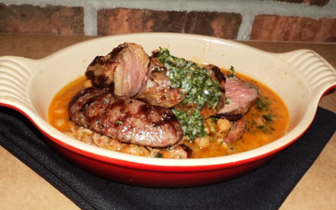 Photo by: Robert Cochrane - The grilled lamb cassoulet at the Ravenous Pig had perfect chunks of lamb with pieces of sausage and pulled duck over chickpea ragu.