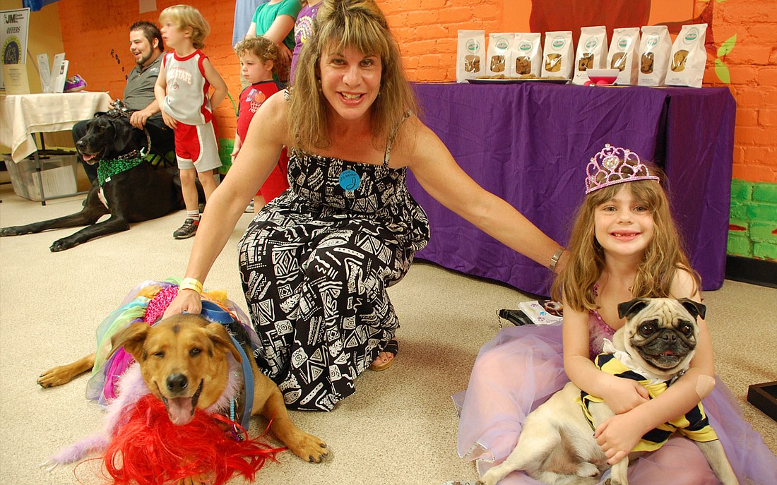 Photo courtesy of JCC - Caryn and Alexa Coultoff with dogs Jack and Johnny at the Roth Jewish Community Center's Second Annual Pawrim Doggie Celebration.