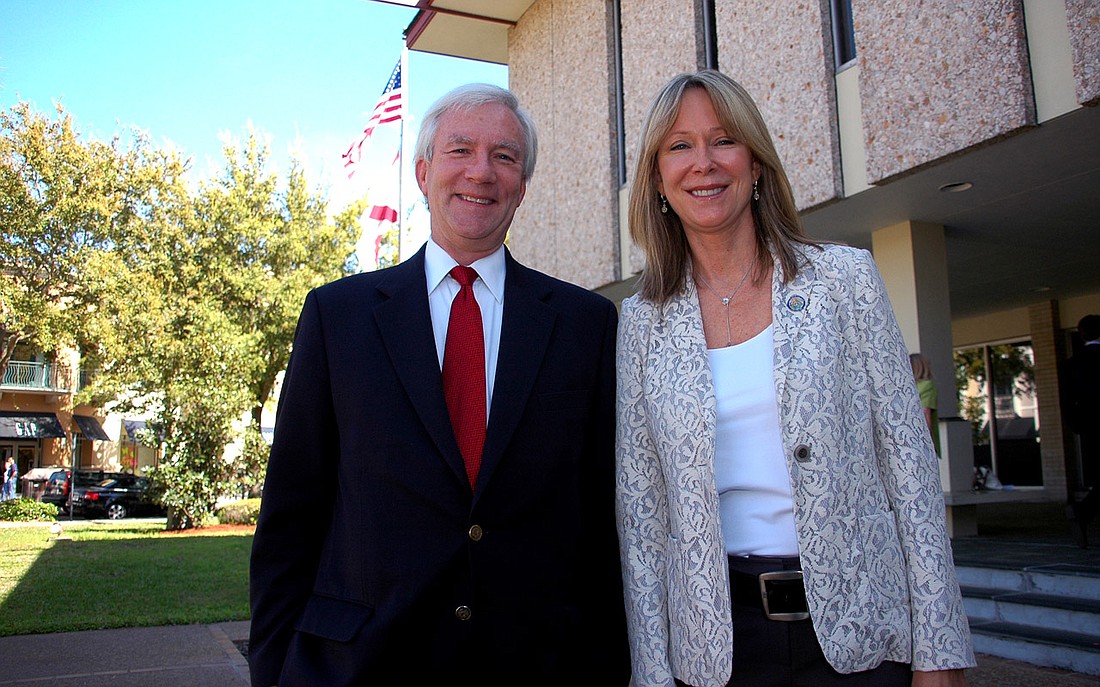 Photo by: Isaac Babcock - Outgoing Winter Park City Commissioners Phil Anderson and Beth Dillaha pose in front of City Hall on March 14.