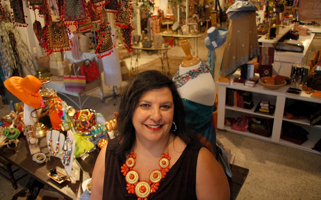 Photo by: Isaac Babcock - Debbie Farah, CEO and founder of Bajalia International Group, shows off her fair trade wares at her Park Avenue store, which opened in December.