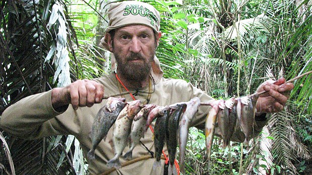 Photo: COURTESY OF MICKEY GROSMAN - Cancer survivor Mickey Grosman shows a line of fish caught for food during a fundraising expedition across the Amazon rainforest.