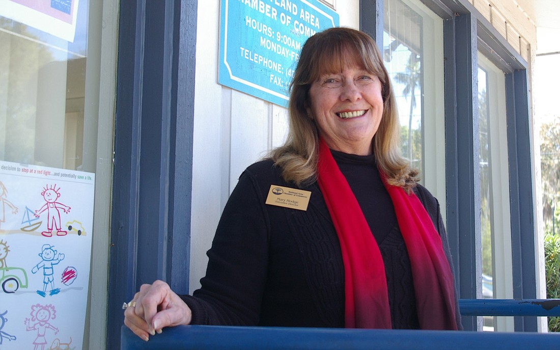 Photo by: Isaac Babcock - Executive Director Mary Hodge poses outside of the Maitland Area Chamber of Commerce, a converted 1930s house.