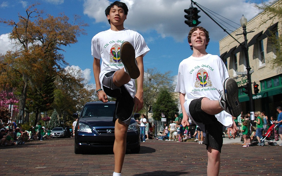 Photo by: Isaac Babcock - Students from Tir Na Graene School of Irish Dance show off their skills on the street during Winter Park's St. Patrick's Day parade.