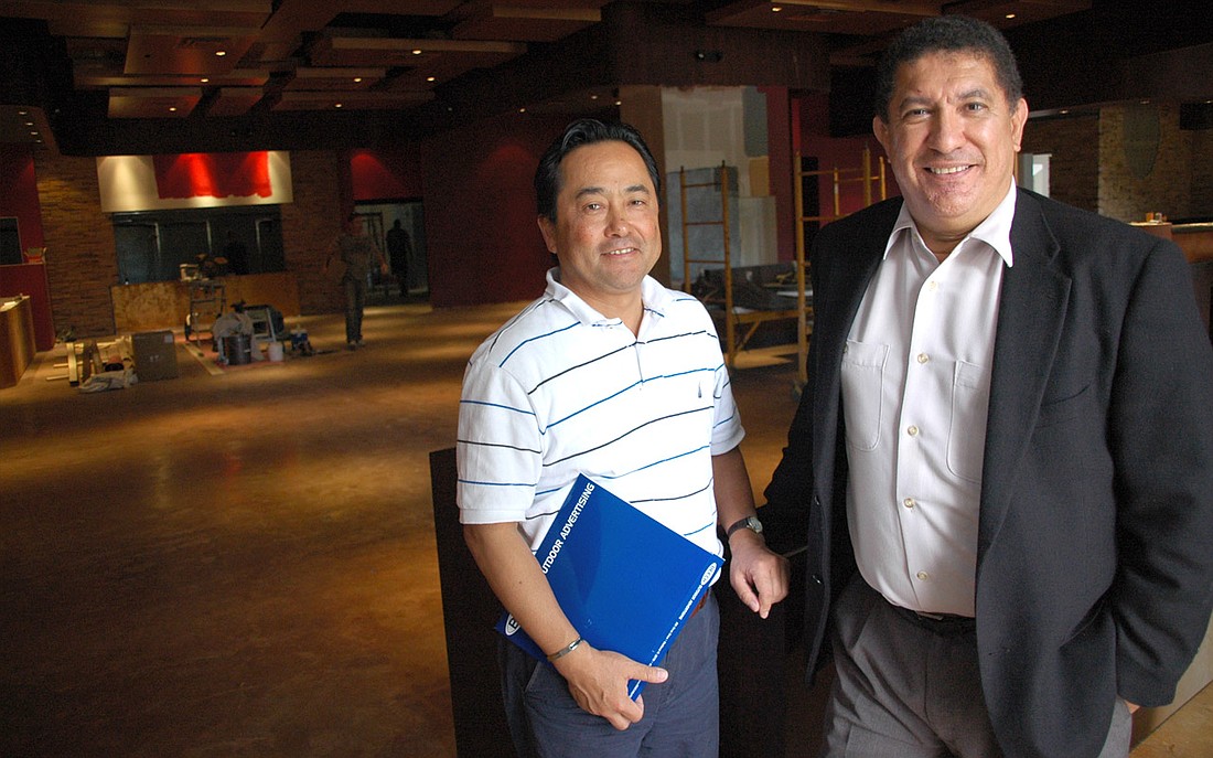 Photo by: Isaac Babcock - Hector Ponce, right, partner member of Ran-Getsu, and Takashi Kikuchi, general manager, pose inside the unfinished restaurant at the Village at Lake Lily.